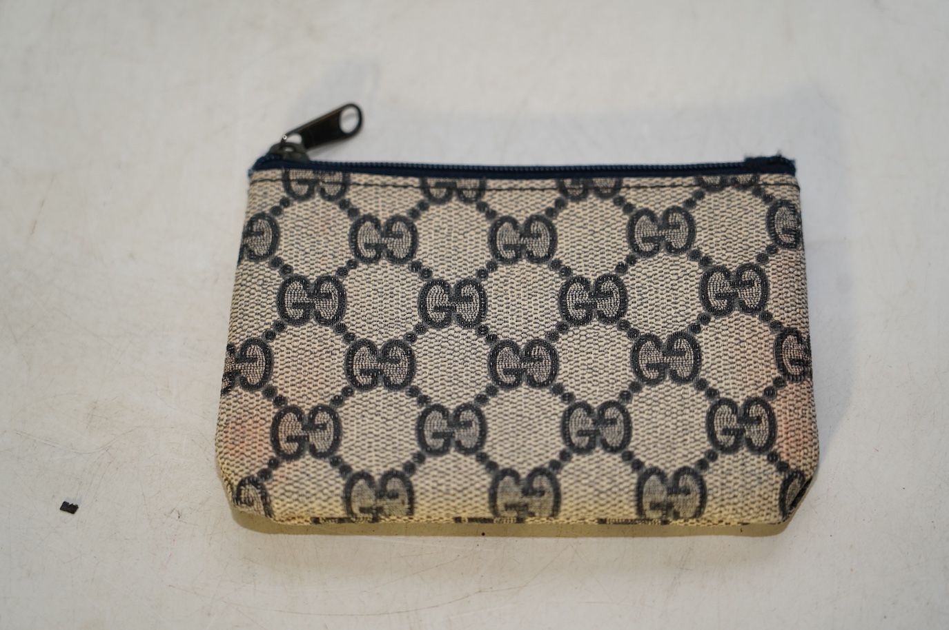 A Gucci monogram blue canvas handbag, wallet and purse